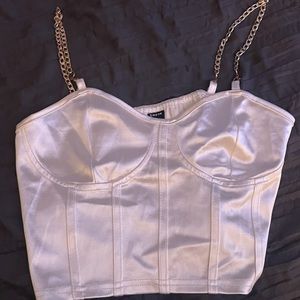 Silky tank top, not great padding but looks good with the right bra